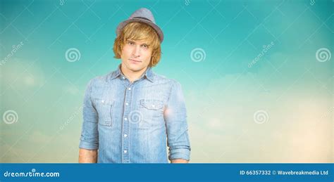 Composite Image Of Serious Blond Hipster Staring At Camera Stock Photo