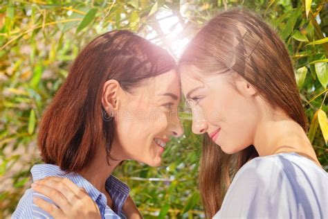 Mum And Daughter Face To Face Looking Each Other Stock Image Image Of