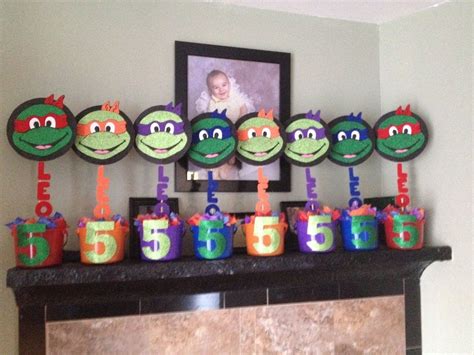 So with all that we have and the fun from our friends, we are shaping up to have one heck of a tmnt 2 viewing party! Ninja Turtles Decoration Ideas Inspirational Diy Ninja Turtle Centerpieces Ninja Turtle Party ...