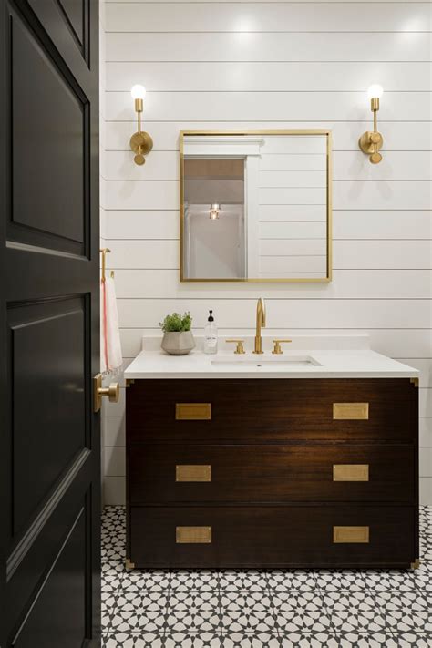 Gray french kitchen cabinets are adorned with brass pulls and hold a microwave drawer beneath a marble countertop fixed against a marble backsplash and. Custom Single-Story Home - Home Bunch Interior Design Ideas