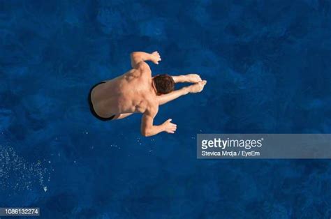 Man Jumping Into Pool Top View Photos And Premium High Res Pictures Getty Images