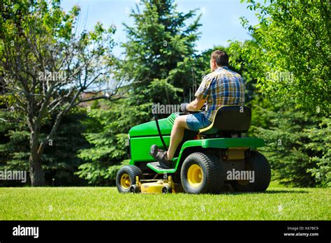 Man Sitting On Lawn Mower Hi Res Stock Photography And Images Alamy