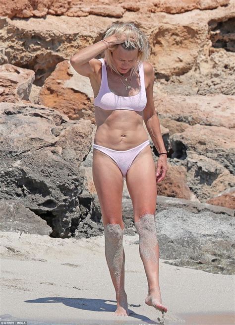 Robin Wright Is Toned In A Pink Bikini As She Shares Passionate Kiss With Husband Clement