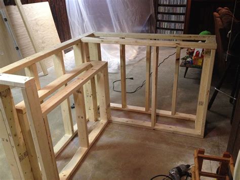 Cut the four pieces of 1×8 lumber at 19″ and use a 4″ hole saw to make the round cuts. bar frame with shelf | Building a home bar, Home bar plans ...