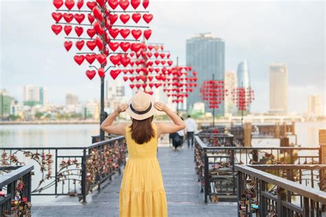 Premium Photo Woman Traveler With Yellow Dress Visiting In Da Nang Tourist Sightseeing At Love