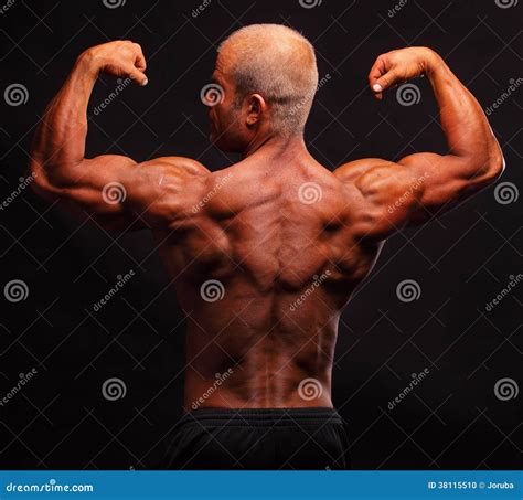 Muscular Bodybuilder Flexing Biceps Stock Photo Image Of Bodybuilder