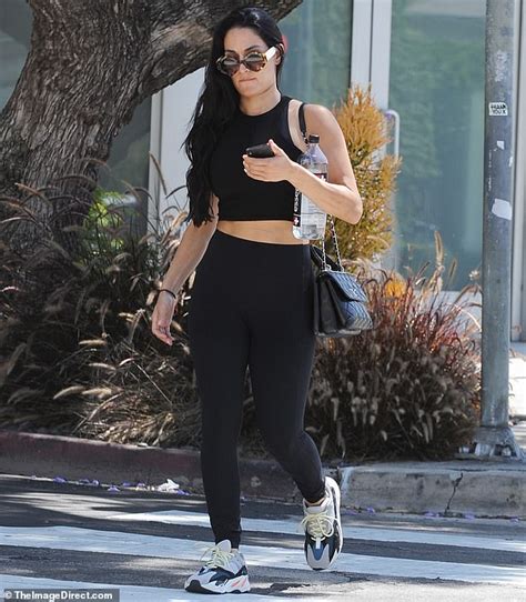 Nikki Bella Flashes Her Tummy As She Carries Three Beverages After A