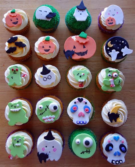 They would make lovely table decorations as well. Halloween Cupcakes | Halloween cupcakes, Cupcakes, Fondant decorations