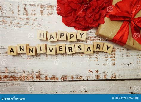 Happy Anniversary Alphabet Letter With T Box On Wooden Background