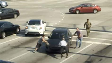 Good Samaritans save a driver having a medical issue at a busy