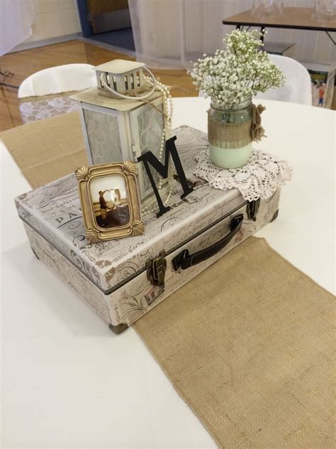 Vintage Centerpiece Using A Suitcase Lantern With Pearls Jars Dipped