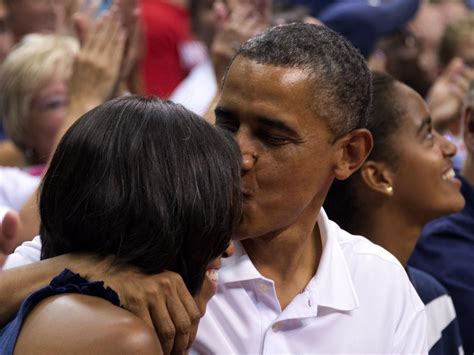 President And Michelle Obama Applauded For Kiss Cam Smooch At Verizon