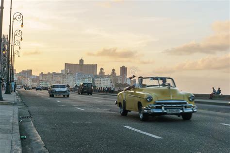 Malecon Typical View In Sunset With La Havana Buildings At Background