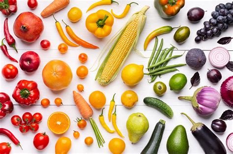 Composition Of Fruits And Vegetables In Rainbow Colors Stock Photo