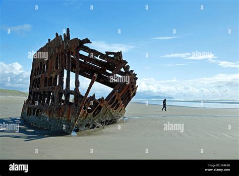 Tourist At Shipwreck Of The Peter Iredale Ship Fort Stevens State Park