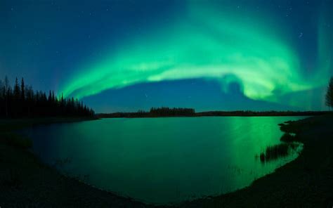 Northern Lights over a lake | Northern lights photo, Northern lights, See the northern lights