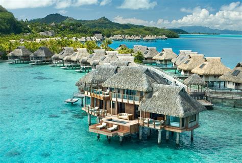 The History Of Tropical Overwater Bungalows — Long A Symbol Of