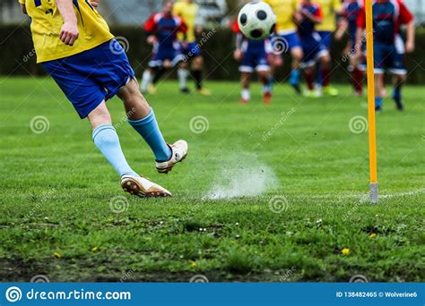 Footballer Kicking The Ball During The Football Match Stock Image ...