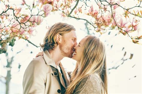 Romantic Couple Kissing Under Blooming Tree Stock Image Image Of Male