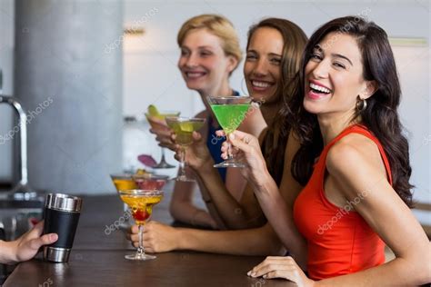 Beautiful Women Having Cocktail Stock Photo By Wavebreakmedia