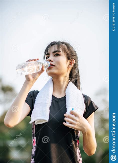 Women Stand To Drink Water After Exercise Stock Image Image Of Park