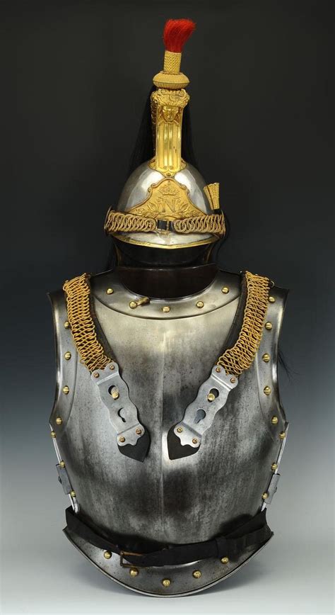 The Helmet Is Made Out Of Metal And Has Gold Trimmings On Its Sides