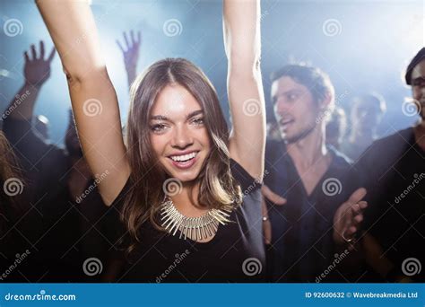 Portrait Of Happy Woman Dancing At Nightclub Stock Photo Image Of