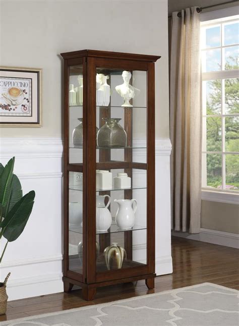 Curio cabinets a decorated and beautifully styled accent curio is sure to be a great enhancement of your décor. Traditional Style Curio Cabinet with Sliding Glass Doors