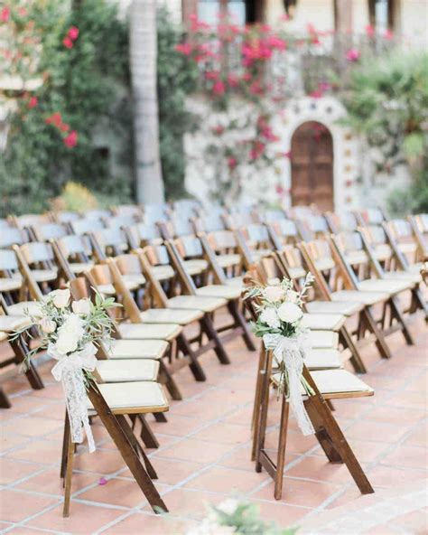 Rows Of Wooden Folding Chairs Set Up For An Outdoor Ceremony With