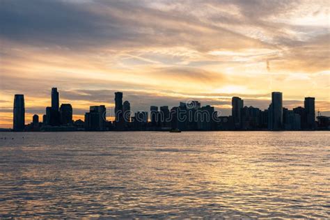 Jersey City Skyline Along The Hudson River During A Beautiful Sunset