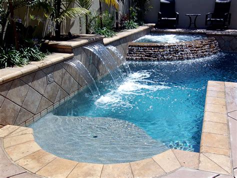 Although water features have very little to do with a pool's surface, they still give off a custom, classy, and permanent feel to the swimming pool. Outdoor Patio Water Feature Geometric Pool Features Custom ...