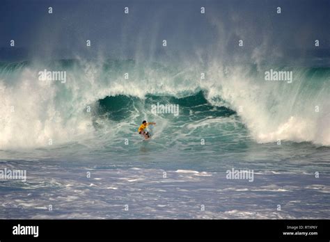 Surfer Rides A Big Wave Waimea Bay North Shore Of Oahu Hawaii Usa