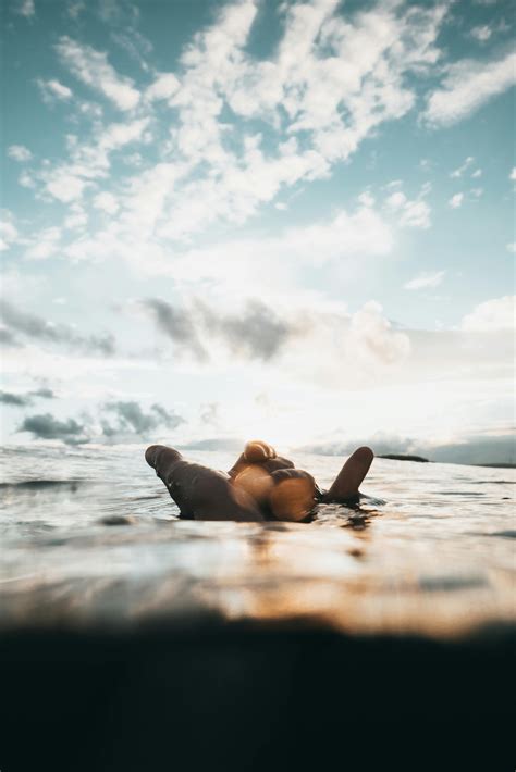 Person Floating On Water At Daytime · Free Stock Photo