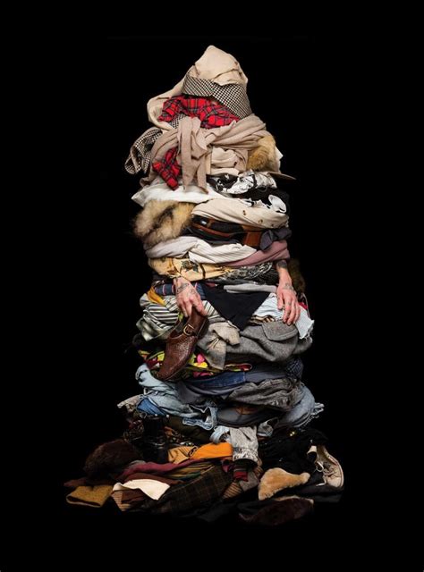 A Pile Of Clothes Sitting On Top Of Each Other