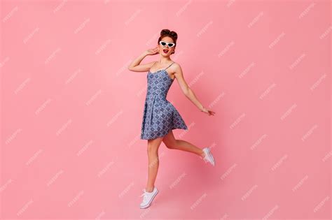 Free Photo Full Length View Of Inspired Lady In Blue Dress Relaxed Pinup Girl Dancing On Pink