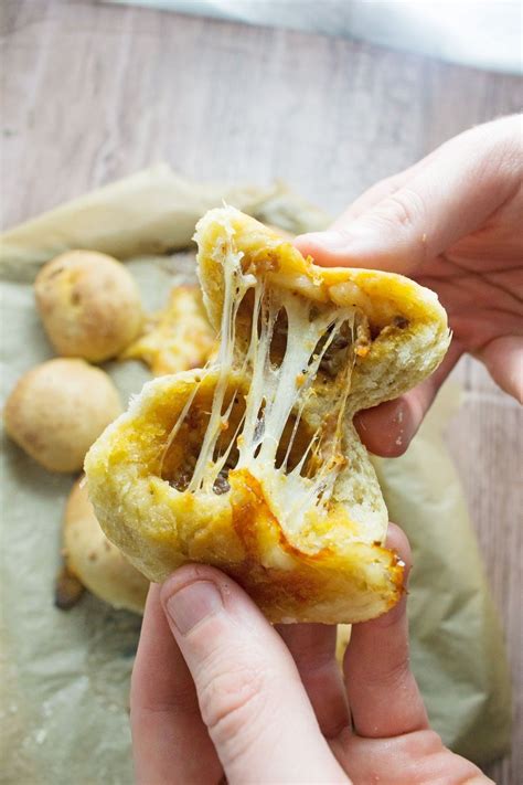 Sprinkle mozzarella cheese over dough to within 1/2 in. These pesto mozzarella stuffed dough balls make a perfect ...