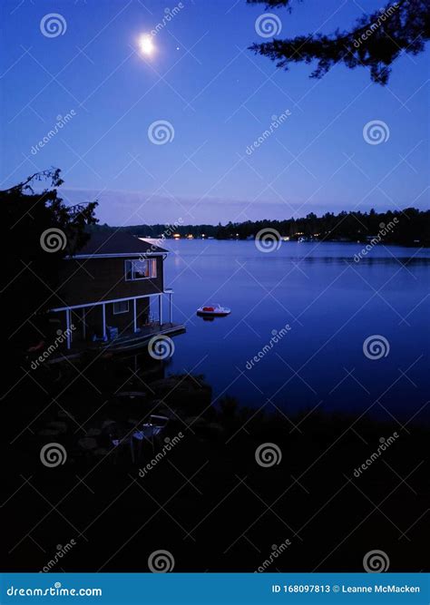 Full Moon Reflection In Lake At Cottage Stock Image Image Of Full