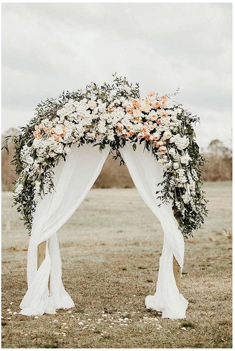Wedding Arch With Fabric Draping Floral Roses And Rings Weddings
