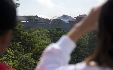 marine spouse presents 11 050 to okinawa governor to help restore fire ravaged shuri castle