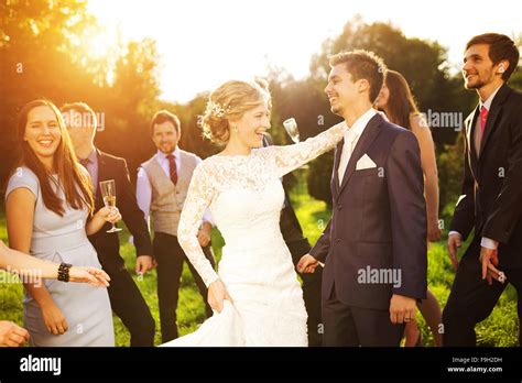 Full Length Portrait Of Newlywed Couple Dancing And Having Fun With