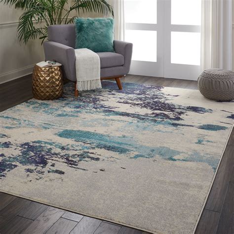 nourison celestial beach abstract ivory teal blue area rug in 2020