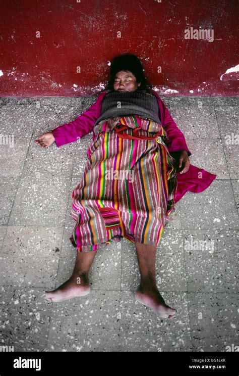 A Woman Is Passed Out At Noon On The Market Floor In Joyabaj Stock