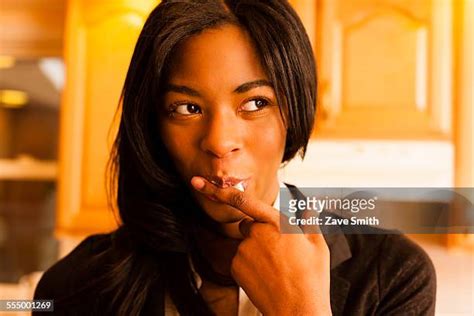 Licking Finger Woman Fotografías E Imágenes De Stock Getty Images