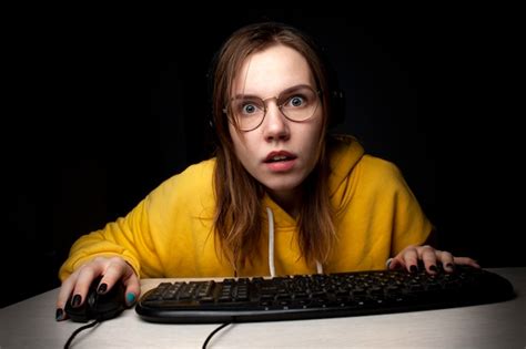 Premium Photo Girl Gamer Sits At A Laptop At Night At Home