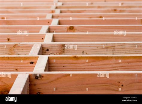 Wood Blocking In A Staggered Pattern Between Floor Joists At A