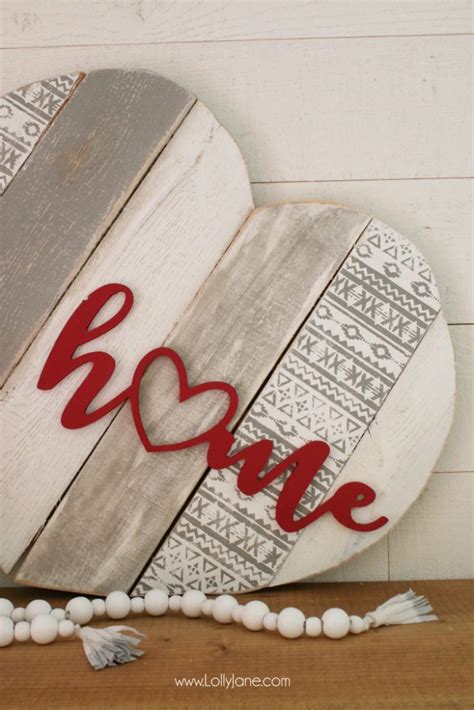 This is a super cute way to recover old pillows! home stenciled pallet heart home decor - Lolly Jane
