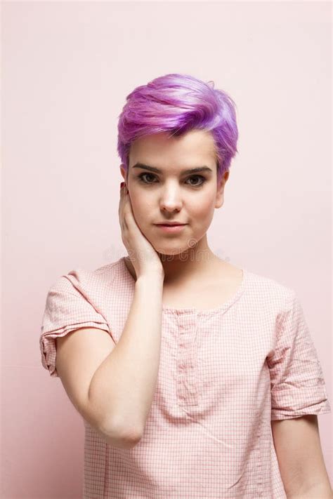 Violet Short Haired Woman In Pink Pastel Holding Her Face Stock Image