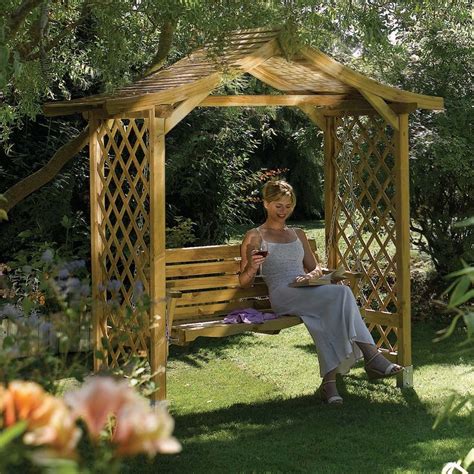 The charm of a simple wooden garden swing will truly come to life in a blooming garden! Lattice Sided Wooden Garden Swing Arbour Seat from ...