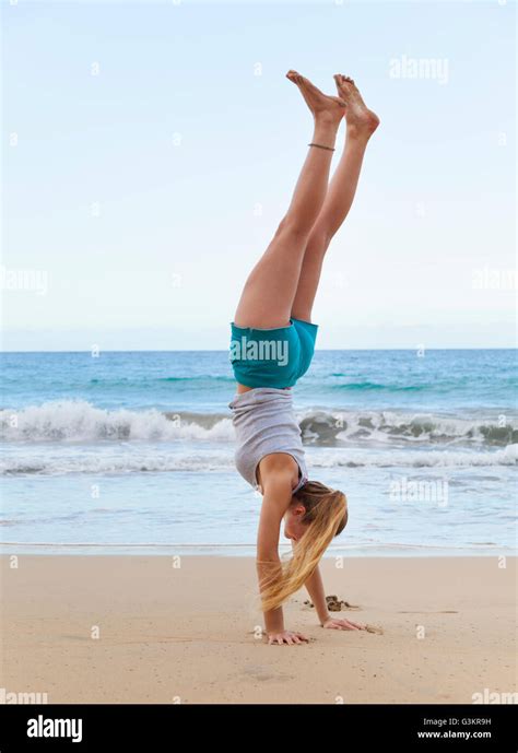 Young Woman Doing Handstand On Beach Dominican Republic The Caribbean