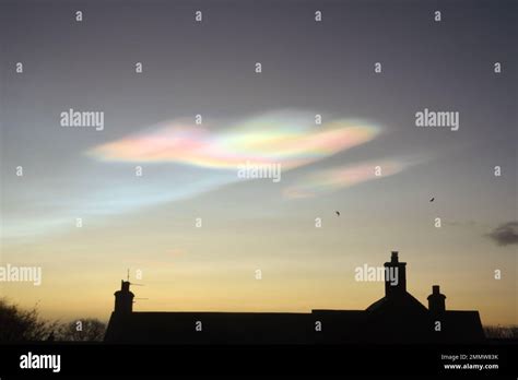 multi coloured nacreous clouds at dawn in golspie scottish highlands uk jan 2023 a rare